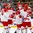 BUFFALO, NEW YORK - JANUARY 2: Denmark's Joachim Blichfeld #20, Lasse Mortensen #14, Malte Setkov #3, and Daniel Nielsen #21 celebrate a first period goal by teammate Jonas Rondbjerg #16 against Belarus during the relegation round of the 2018 IIHF World Junior Championship. (Photo by Andrea Cardin/HHOF-IIHF Images)

